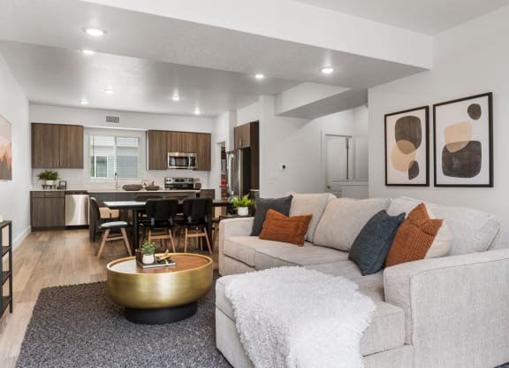 our apartments offer a living room with a sofa coffee table and a kitchen with a breakfast bar
