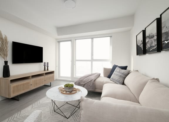 a living room with a couch and a table and a television