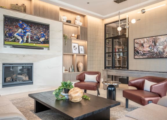 a living room with a fireplace and a tv on the wall