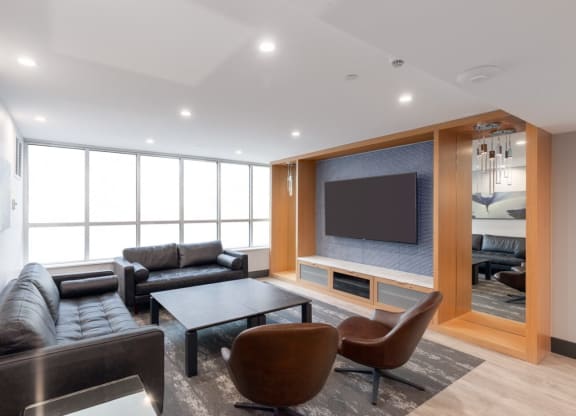 a living room with a couch and a table and a television
