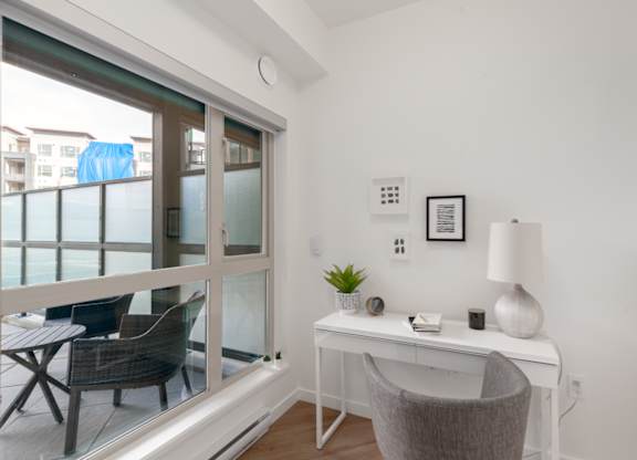 A room with a desk and a chair.