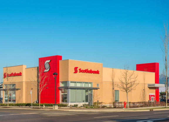 the front of a supermarket with a blue sky