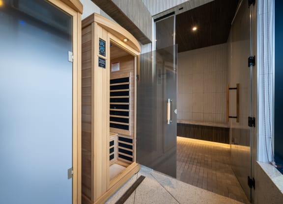 a sauna with a glass door