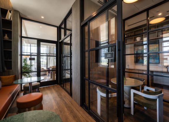 a room filled with furniture and a large window