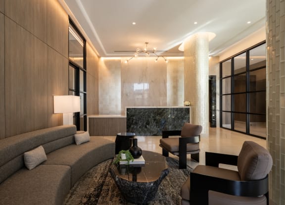 a living room filled with furniture and a large window