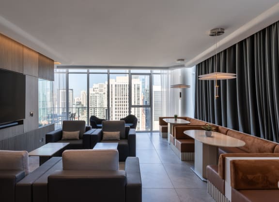 a living room filled with furniture and a large window