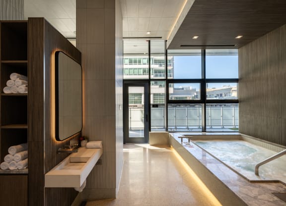a bathroom with a large window and a bathtub