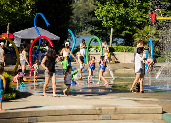 A group of people are playing in a water park.