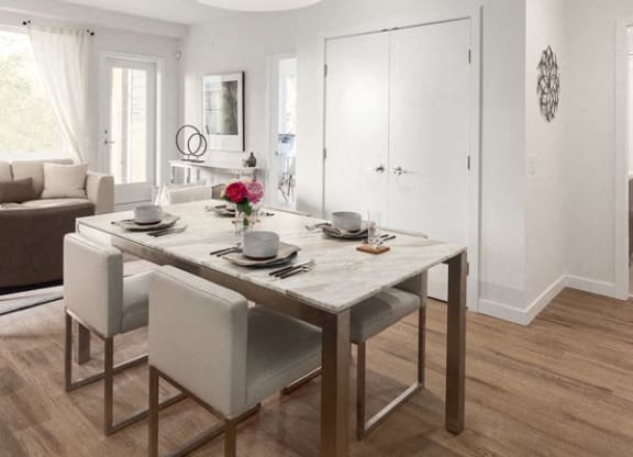 a dining room with a table and chairs