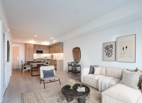 a living room with a white couch and a table
