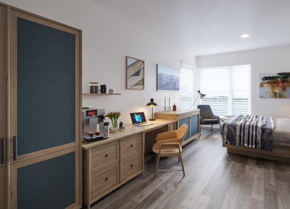 a bedroom with a bed and a desk in a room at Marina Square, Bremerton, WA, 98337