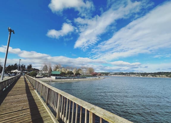 a wooden pier with a blue sky in the background at Rivulet, Washington, 98383