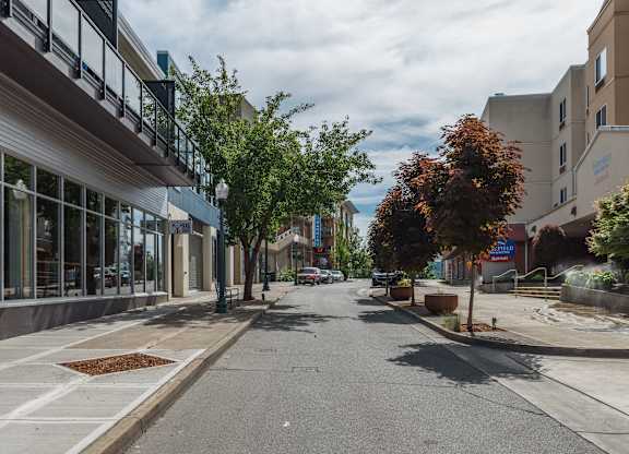 A street view with buildings on the side and a clear sky at B Flats Apartments, Bremerton, 98337