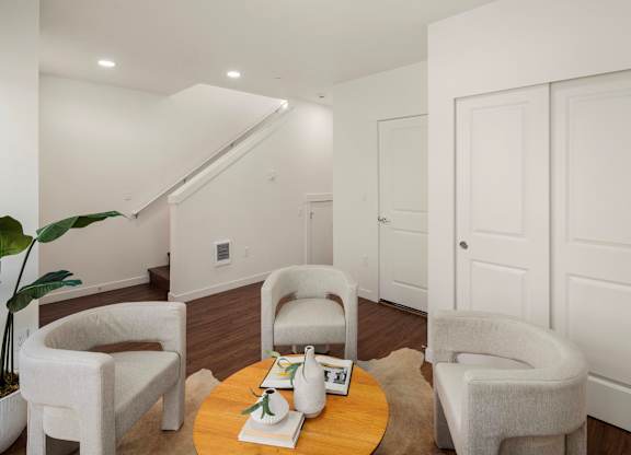 A living room with a couch, chair, and coffee table. at The Narrows at Clare Apartments , Bremerton
