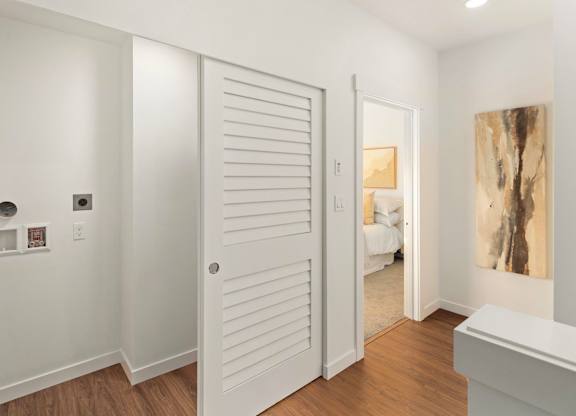 A white door with a small window above it. at The Narrows at Clare Apartments , Apartments, Bremerton, WA