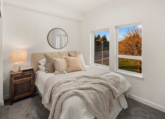 A bedroom with a large bed at The Narrows at Clare Apartments , Washington