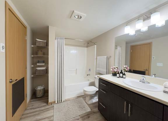 a bathroom with a sink and a toilet and a shower at Spyglass Hill Apartments, Washington