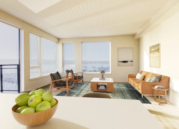 a living room with a couch and a table with a bowl of fruit on top of it at Marina Square, Bremerton, WA, 98337