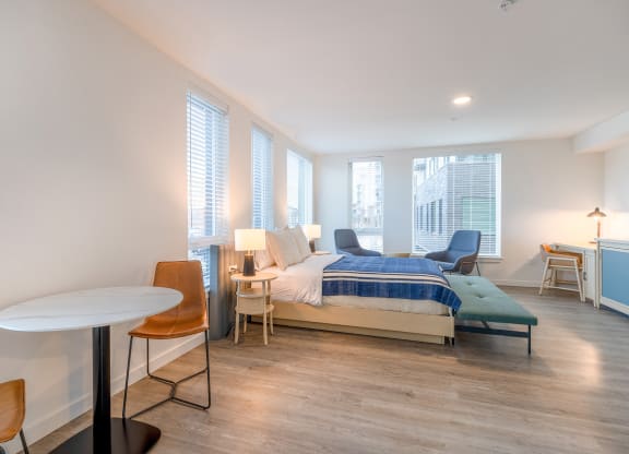 a bedroom with a bed and a desk in a room at Marina Square, WA 98337