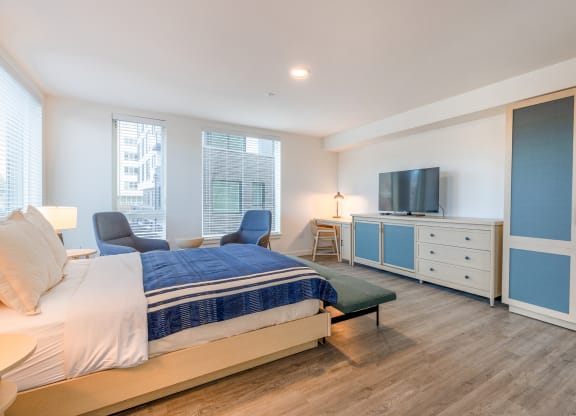 a bedroom with a bed and a television at Marina Square, Bremerton, WA