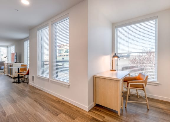 a living area with hardwood floors and large windows at Marina Square, WA 98337