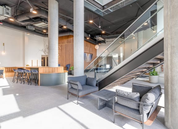 Lobby with staircase, ample seating, and natural light at Marina Square, Bremerton, Washington 98337