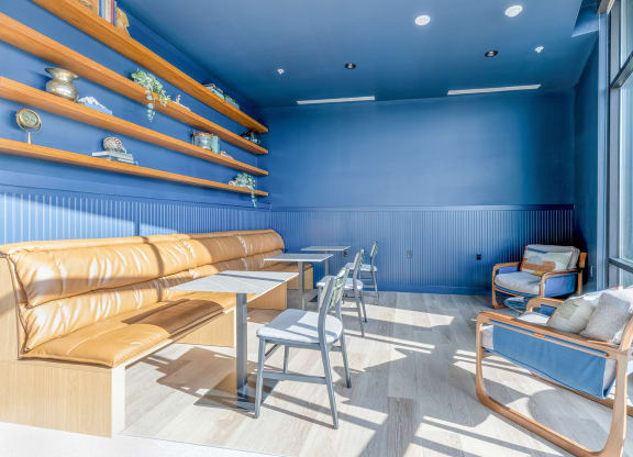 a seating area with a couch chairs and tables at Marina Square, Washington
