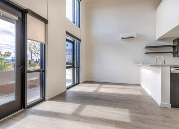 a kitchen and living room with sliding glass doors at Marina Square, WA 98337