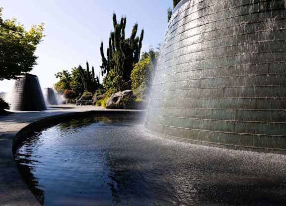 A wall with water flowing out of it.