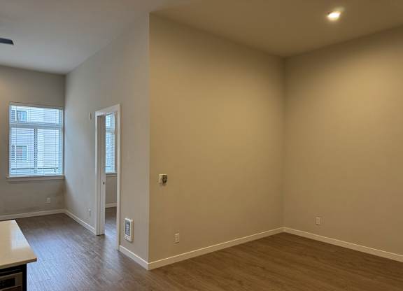 A room with a window and a door at B Flats Apartments, Washington