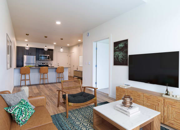 a living room with a couch and a table with a television at Rivulet, Washington, 98383