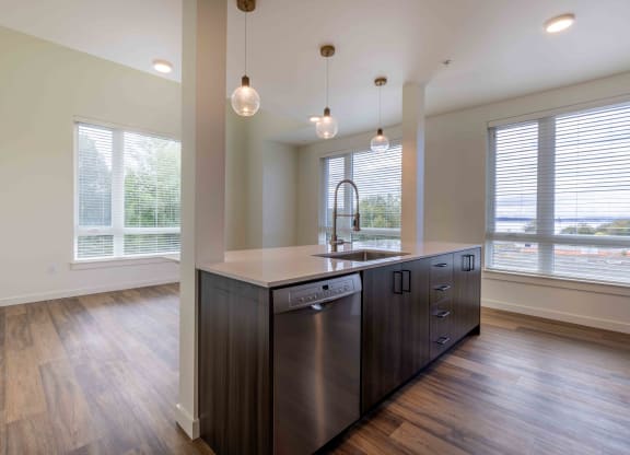 an empty kitchen with a large window and a sink at Rivulet, Silverdale