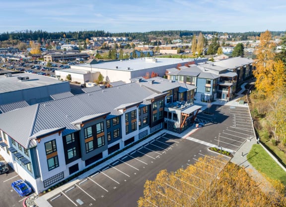 an aerial view of a building with a city in the background at Rivulet, Silverdale, 98383