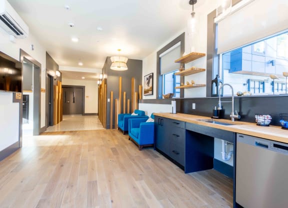 a long kitchen and living room with a large window and a long hallway at Rivulet, Silverdale Washington