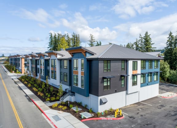 an aerial view of a row of houses in a parking lot at Rivulet, Silverdale