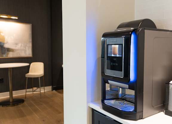 A modern kitchen with a coffee machine on the counter at The Crest at South Point Apartments, Davenport , GA, 30253