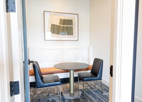 coworking office space with banquet and table with chairs seating