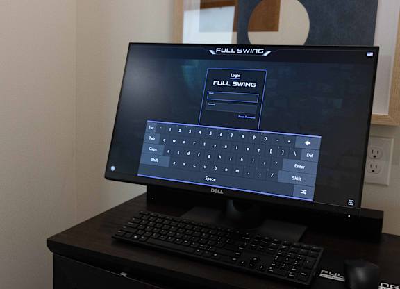 A Dell computer monitor with a Full Swing display setting. at The Crest at South Point Apartments, Georgia