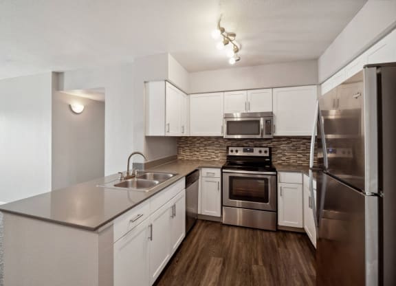 spacious kitchen with stainless steel appliances at Dakota Ridge apartments