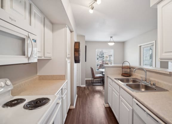 spacious kitchen with white cabinets at Dakota Ridge apartments