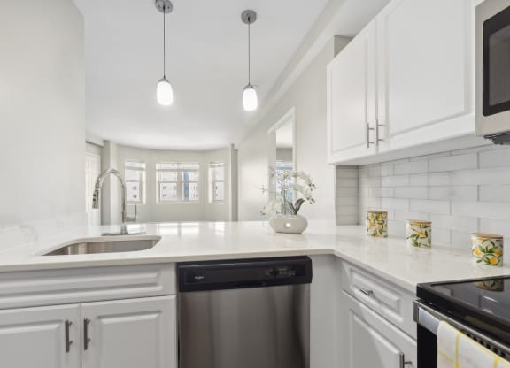 kitchen with designer pendant lighting and custom cabinetry at HighPoint luxury apartments