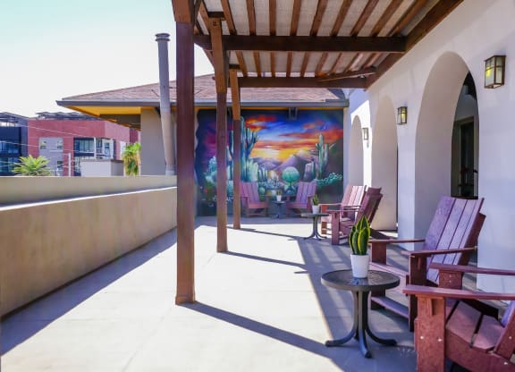 patio with covered lounging area at Roosevelt Square apartments