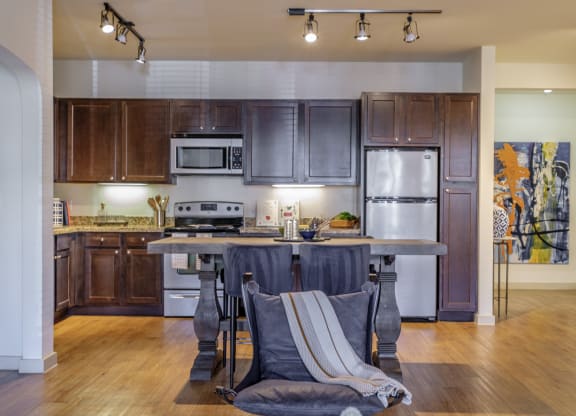 spacious kitchen with stainless steel appliances at The Pradera apartments
