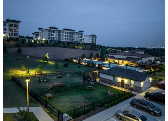 aerial view of the dog park and swimming pool at Reveal Skyline apartments
