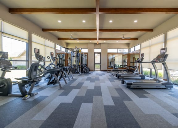fitness center with cardio equipment at The Pradera apartments