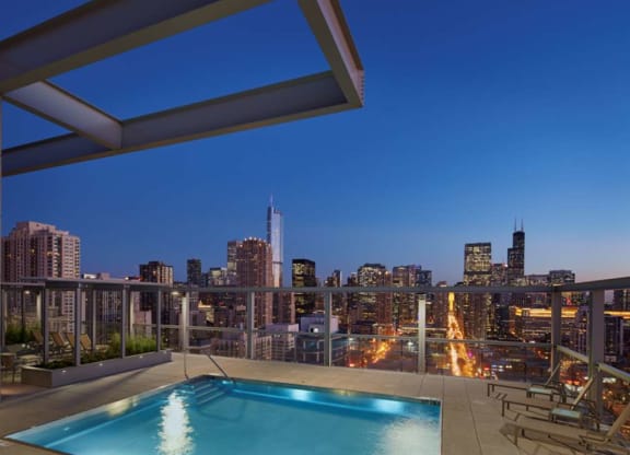 Lit Swimming Pool at Night at 805 N. Lasalle Drive Apartments