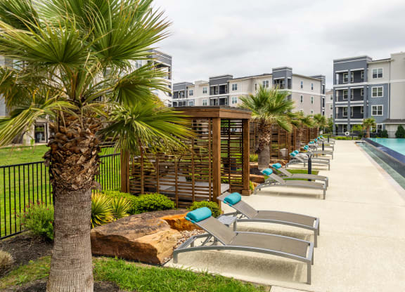 poolside tanning deck and cabanas at Berkshire Creekside apartments
