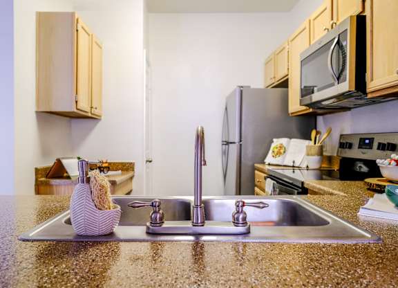 luxury kitchen with stainless steel appliances at San Marin apartments