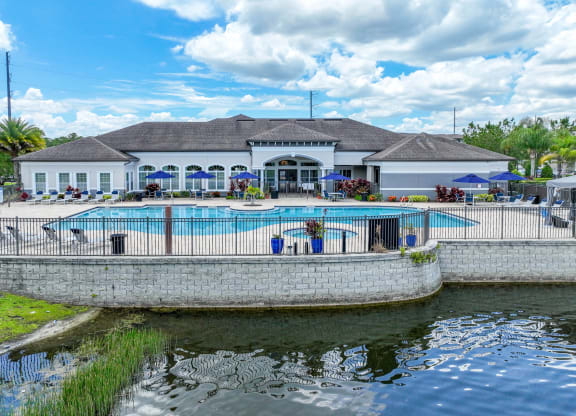 lakeside swimming pool at The Reserves at Alafaya apartments