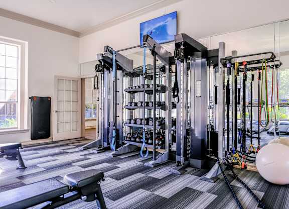 a fitness room with cardio equipment at San Marin apartments